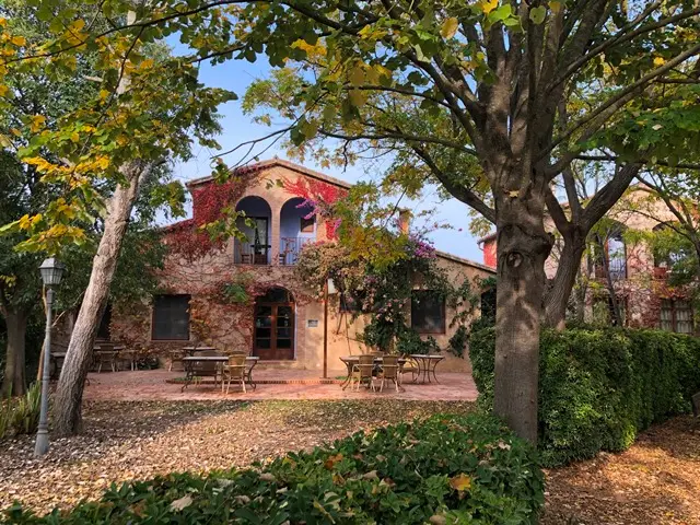 traditional farmhouse with trees around near barcelona