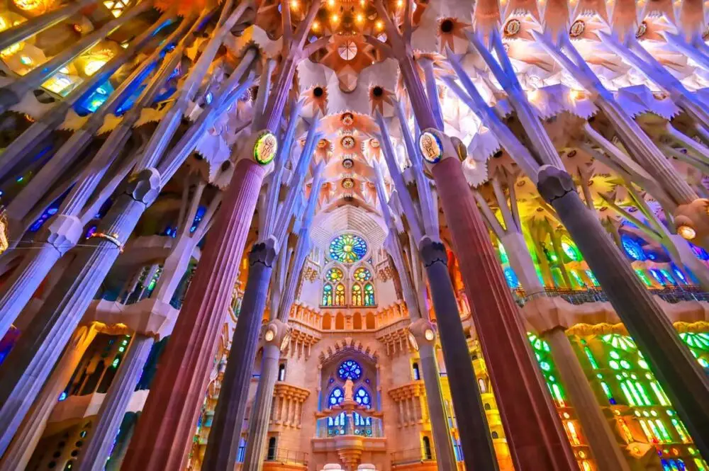 Discover the Sagrada Familias stunning stained glass and columns—an essential Gaudí stop on any Barcelona event with MIT Creators DMC.